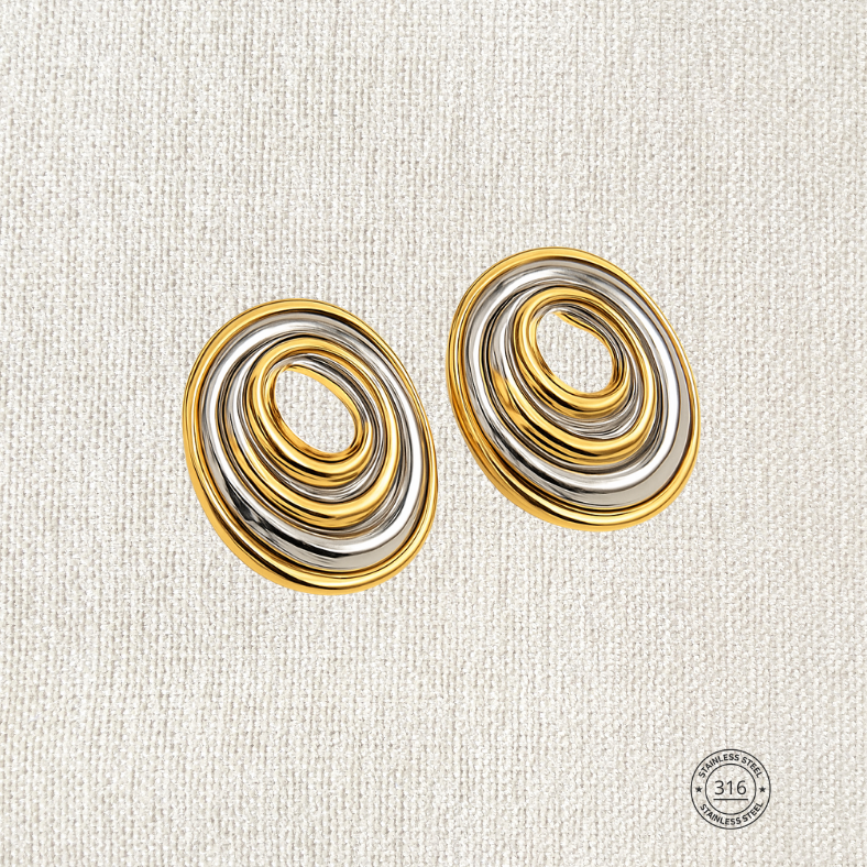 Aretes ovalo, dorado con plateado. Acero inoxidable.
