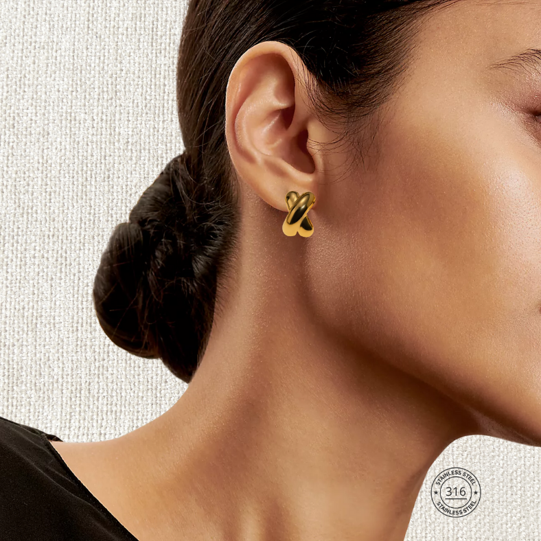 Arete cross dorado, acero inoxidable.