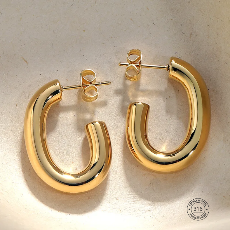 Arracada dorada, acero inoxidable.